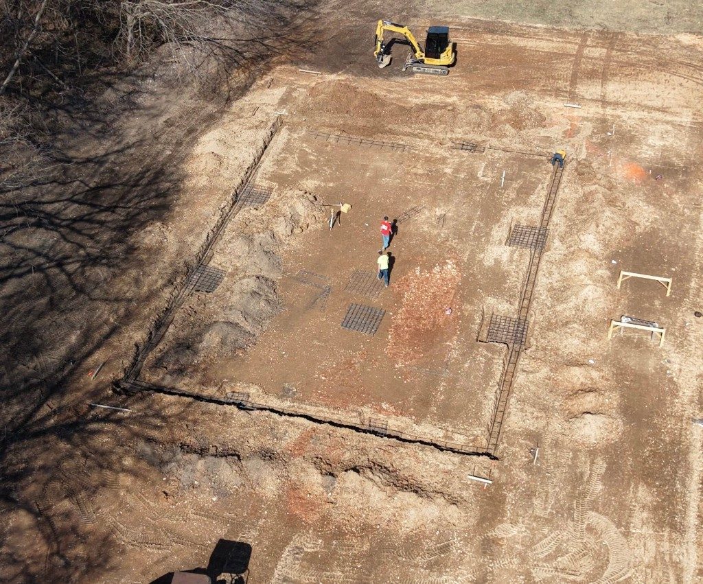 Aerial view of a graded building pad and site preparation