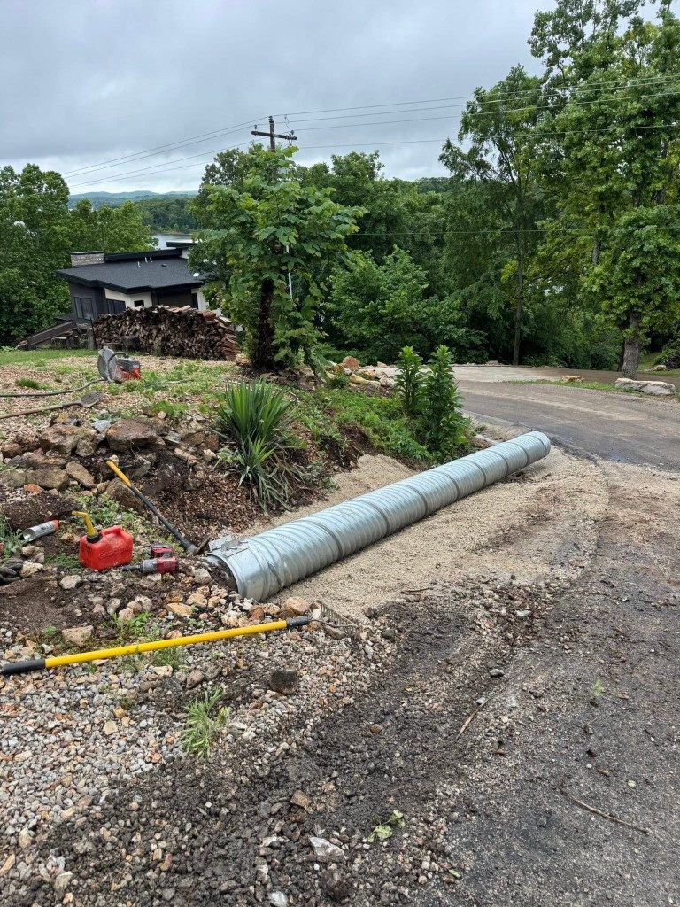 Culvert pipe set along a lake-property driveway