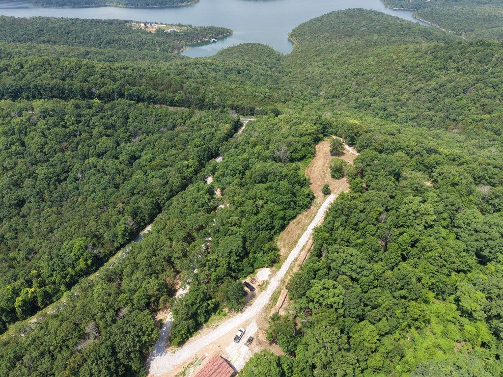 Aerial view of a cleared lakefront lot and access road in Southwest Missouri